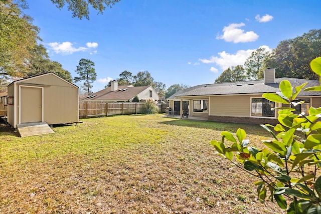 view of yard featuring a storage unit