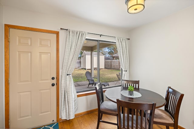 dining area with hardwood / wood-style flooring