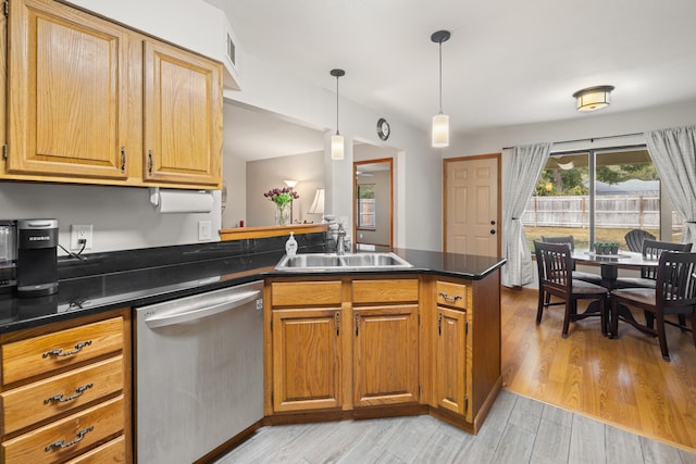 kitchen with sink, hanging light fixtures, stainless steel dishwasher, kitchen peninsula, and light hardwood / wood-style flooring