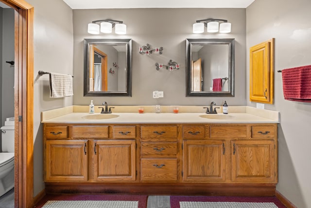 bathroom with vanity and toilet