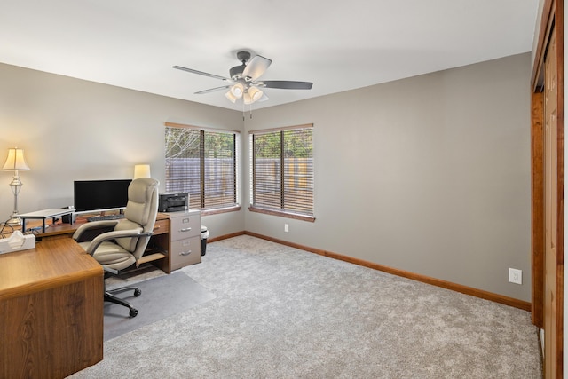 carpeted office with ceiling fan