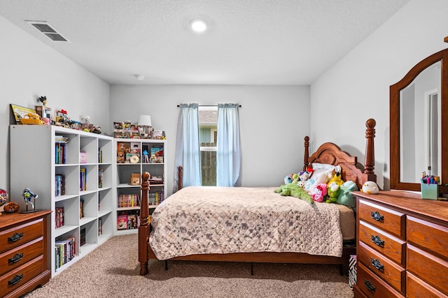 carpeted bedroom featuring a textured ceiling