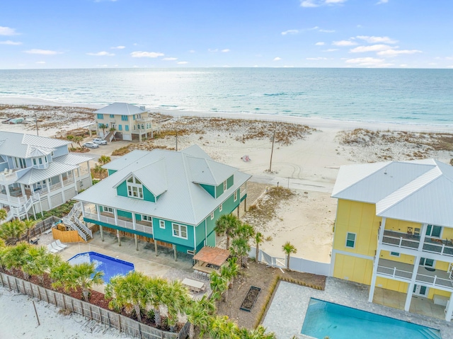 aerial view featuring a water view and a view of the beach