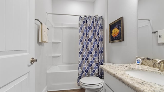 full bathroom with wood finished floors, vanity, toilet, and shower / bath combo with shower curtain