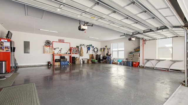 garage with a garage door opener and electric panel