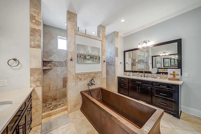 bathroom featuring ornamental molding, shower with separate bathtub, tile patterned floors, and vanity