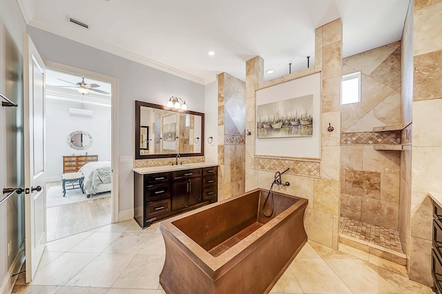 bathroom with tile walls, vanity, ornamental molding, and tile patterned flooring