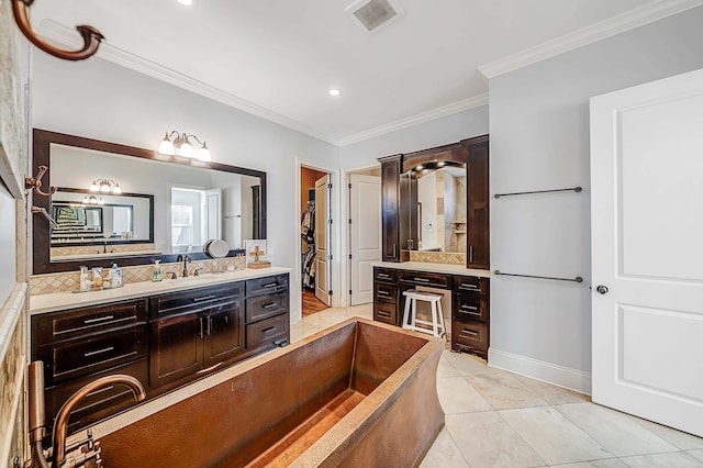 bathroom with ornamental molding, tile patterned flooring, tasteful backsplash, and vanity