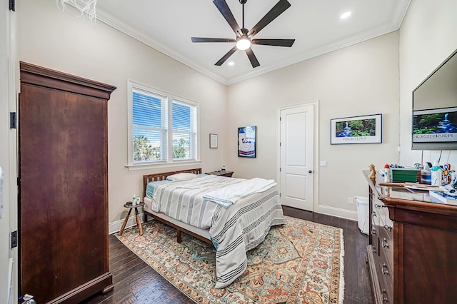 bedroom featuring ceiling fan, dark hardwood / wood-style flooring, and ornamental molding