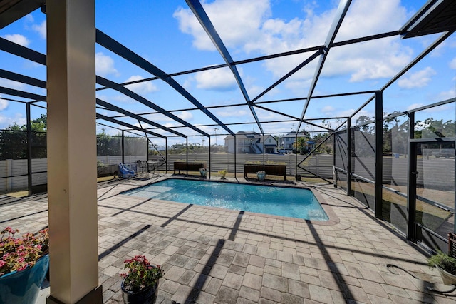 view of pool featuring a lanai and a patio area