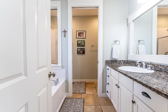 bathroom with vanity and independent shower and bath