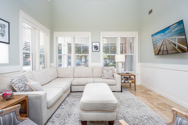 living room with a high ceiling