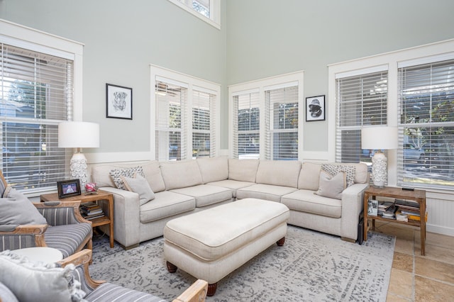 living room featuring plenty of natural light and a high ceiling