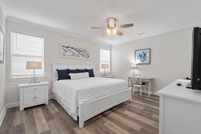 bedroom featuring ceiling fan, wood-type flooring, and ornamental molding