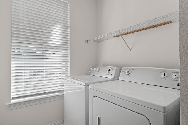 washroom with independent washer and dryer