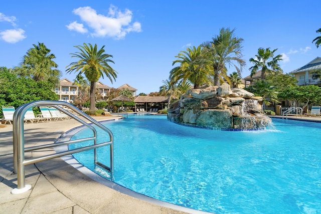 view of pool with pool water feature