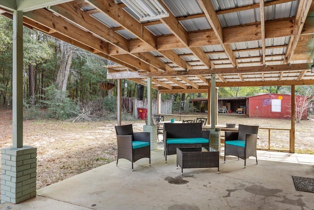 view of patio / terrace with a shed and outdoor lounge area