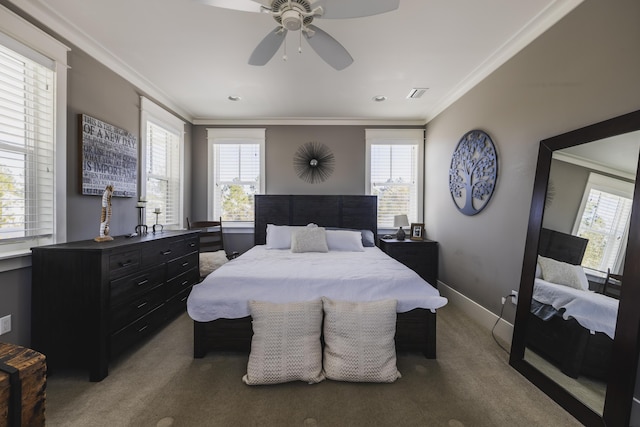 carpeted bedroom with crown molding, ceiling fan, and multiple windows