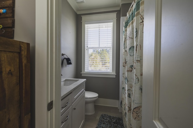 bathroom with vanity, tile patterned floors, and toilet