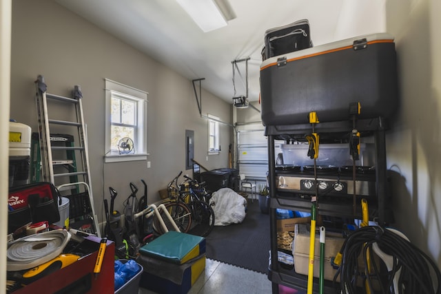 garage with a garage door opener and electric panel