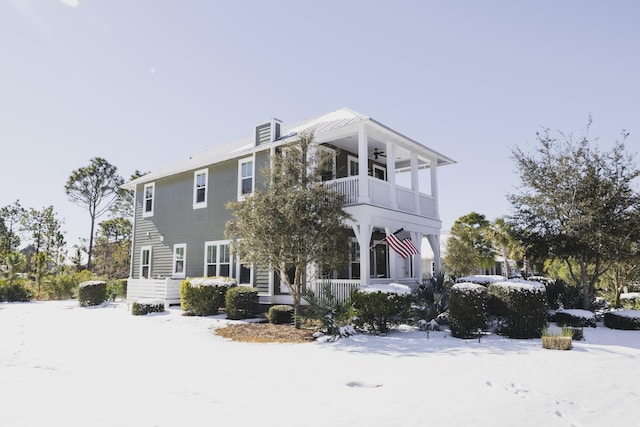 view of front of house with a balcony