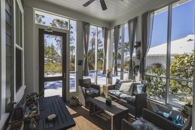 sunroom featuring ceiling fan