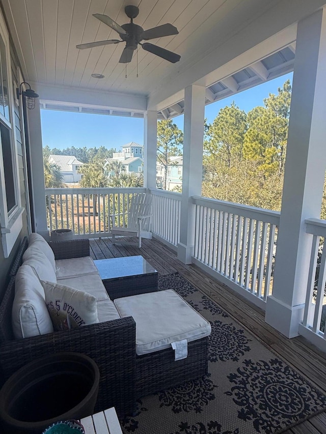 deck featuring an outdoor living space and ceiling fan