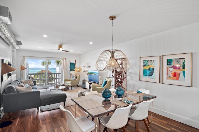 dining room with an inviting chandelier and dark hardwood / wood-style flooring