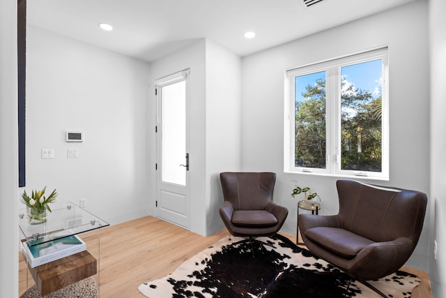 sitting room featuring hardwood / wood-style flooring