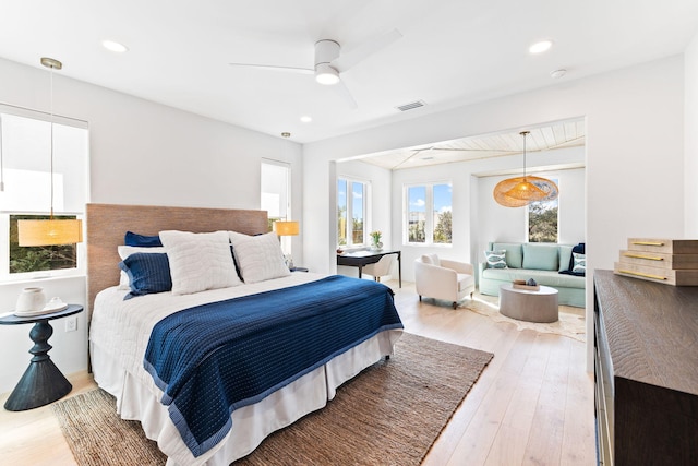 bedroom with ceiling fan and hardwood / wood-style floors