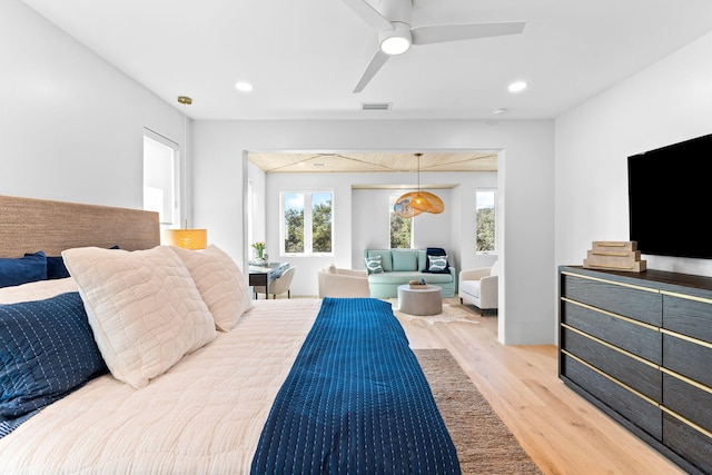 bedroom featuring ceiling fan and light hardwood / wood-style floors