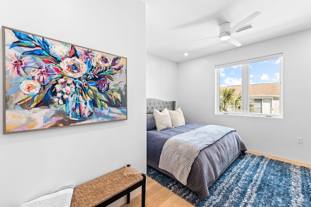 bedroom featuring ceiling fan and hardwood / wood-style floors