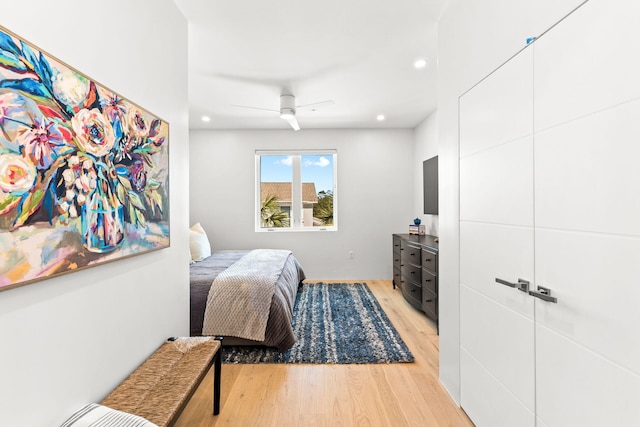 bedroom featuring ceiling fan and light hardwood / wood-style flooring