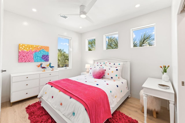 bedroom featuring ceiling fan and light hardwood / wood-style flooring