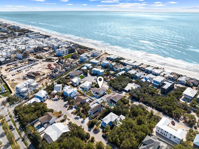 birds eye view of property featuring a view of the beach and a water view