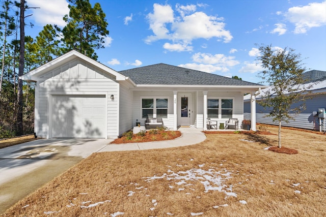 ranch-style home with a porch and a garage