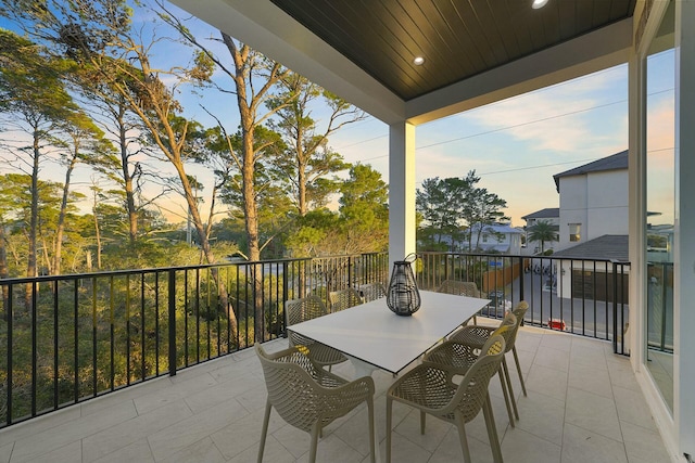 view of balcony at dusk