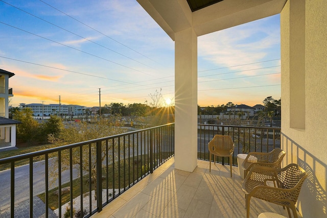 view of balcony at dusk