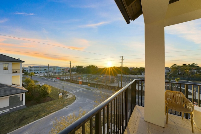 view of balcony at dusk