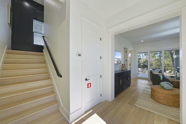 staircase featuring wood-type flooring