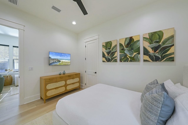 bedroom featuring ceiling fan and light hardwood / wood-style flooring