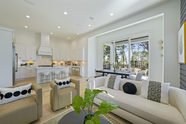 living room featuring light wood-type flooring