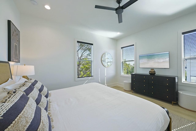 bedroom featuring ceiling fan and light hardwood / wood-style floors