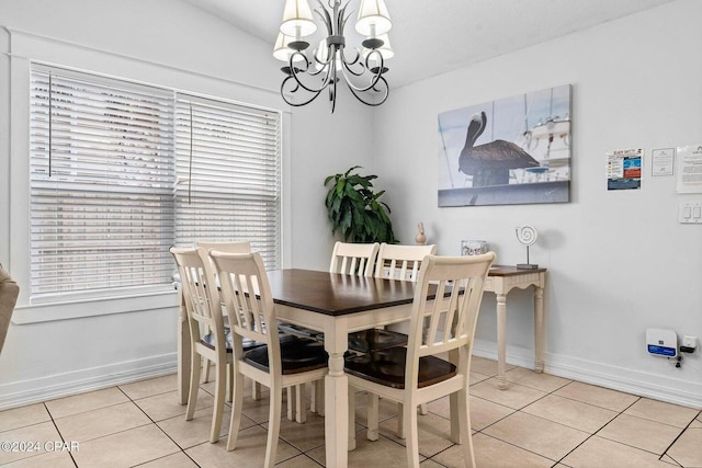 5620 Pinetree Ave, Panama City Beach, FL 32408 - dining room featuring an inviting chandelier and light tile patterned floors