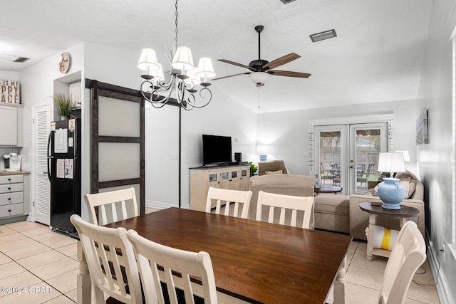 5620 Pinetree Ave, Panama City Beach, FL 32408 - tiled dining space with lofted ceiling, ceiling fan with notable chandelier, and french doors