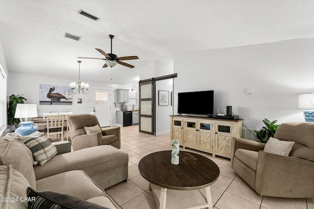 5620 Pinetree Ave, Panama City Beach, FL 32408 - living room featuring ceiling fan with notable chandelier, lofted ceiling, light tile patterned floors, a barn door, and a textured ceiling