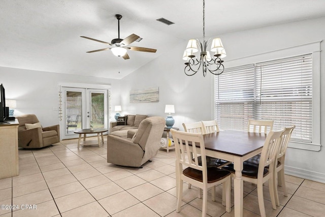 5620 Pinetree Ave, Panama City Beach, FL 32408 - dining space featuring french doors, lofted ceiling, ceiling fan with notable chandelier, and light tile patterned floors