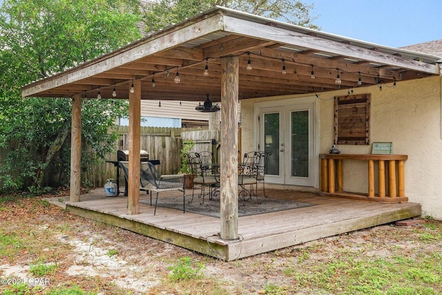 5620 Pinetree Ave, Panama City Beach, FL 32408 - wooden deck with french doors and area for grilling