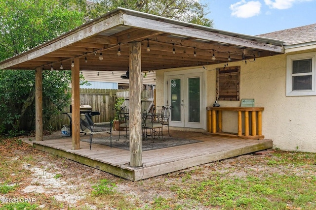 5620 Pinetree Ave, Panama City Beach, FL 32408 - wooden deck with a grill and french doors