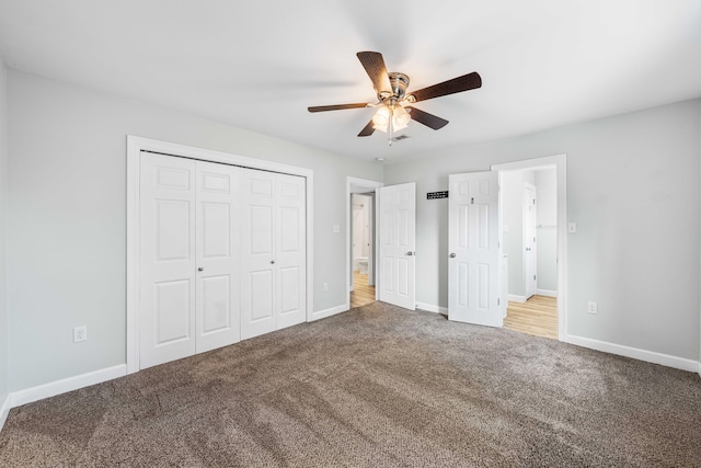 unfurnished bedroom featuring ceiling fan, carpet flooring, and a closet